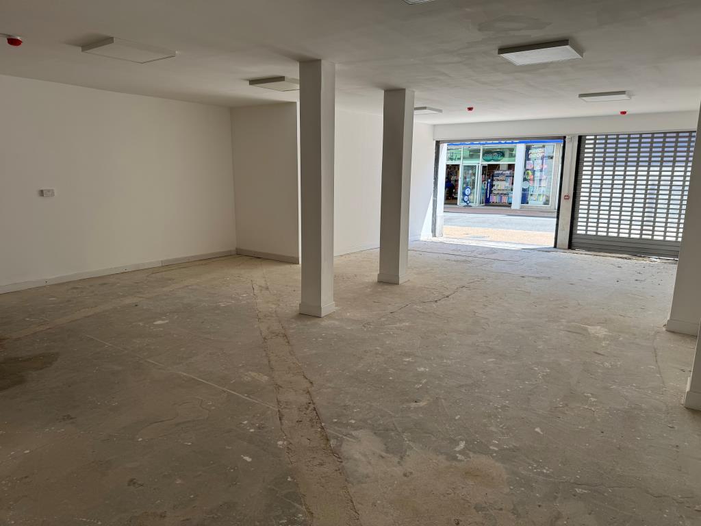 Lot: 46 - TOWN CENTRE LOCK-UP SHOP FOR INVESTMENT OR OWNER OCCUPATION - Looking from towards the back of the Shop with High Street Visible